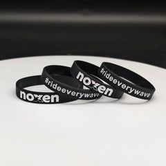 NOXEN Charity Wristbands – Ride Every Wave for Change